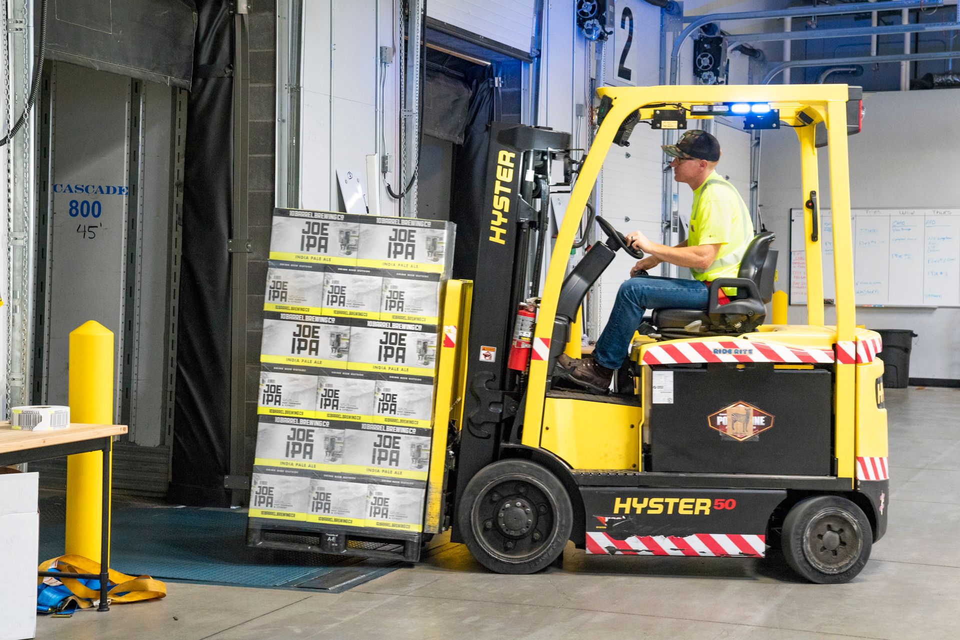 Warehouse worker operating a forklift