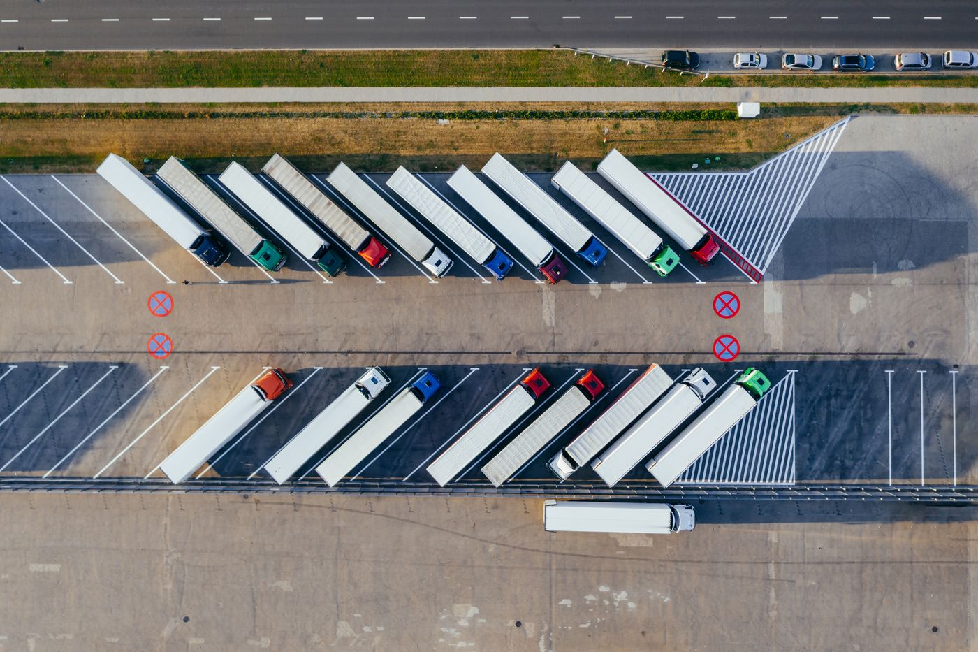 Aerial view of a fleet of trucks parked at a hub